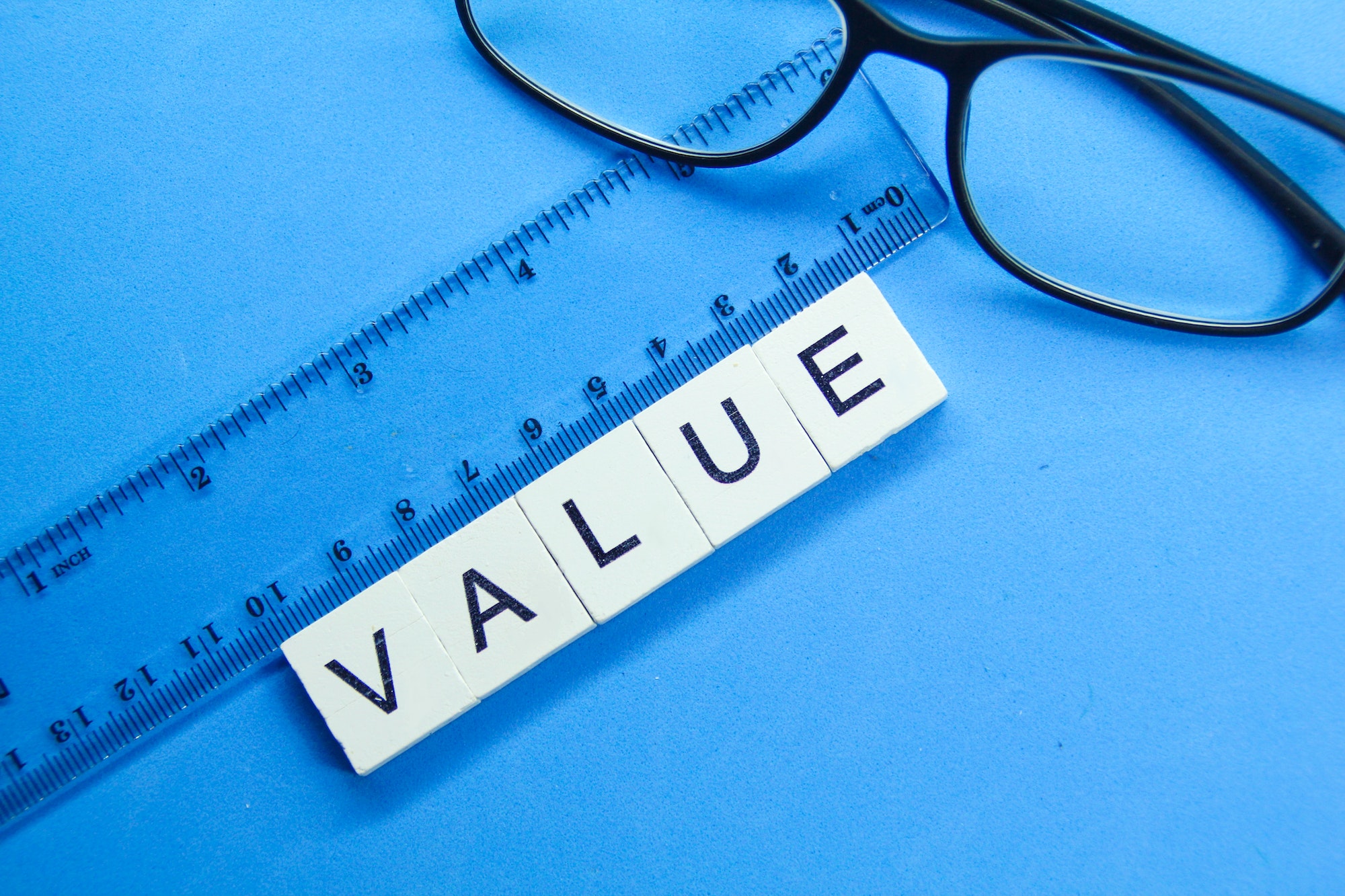 glasses, rulers with value words. the concept of value